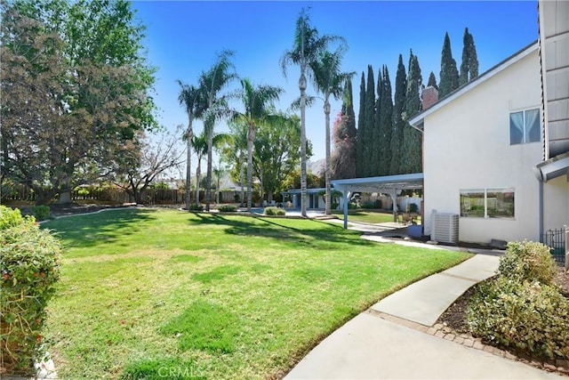 view of yard with fence and cooling unit