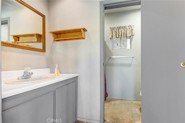 bathroom with concrete floors and vanity