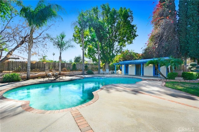 view of pool with fence, a fenced in pool, and a patio