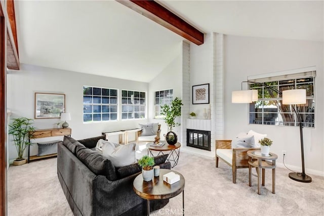 living room featuring light colored carpet, a brick fireplace, high vaulted ceiling, beamed ceiling, and baseboards