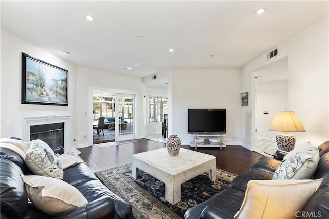 13440 Pala Ave, Sylmar, CA 91342 - living area with dark wood finished floors, recessed lighting, baseboards, and a glass covered fireplace