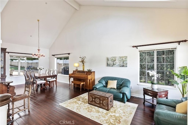 13440 Pala Ave, Sylmar, CA 91342 - living room with high vaulted ceiling, a chandelier, beamed ceiling, dark wood-style floors, and baseboards