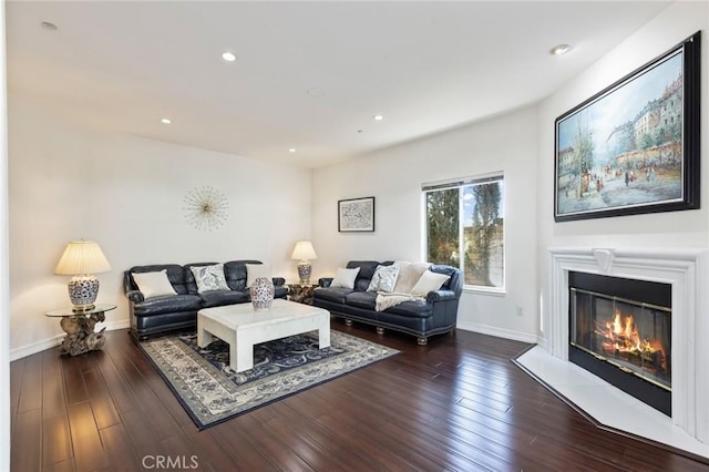 13440 Pala Ave, Sylmar, CA 91342 - living room with baseboards, dark wood finished floors, a glass covered fireplace, and recessed lighting