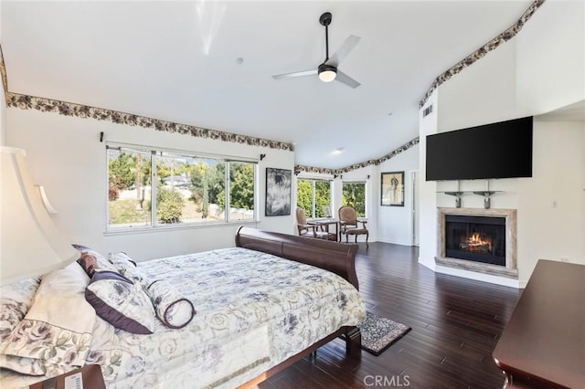 13440 Pala Ave, Sylmar, CA 91342 - bedroom featuring lofted ceiling, a warm lit fireplace, and dark wood-type flooring