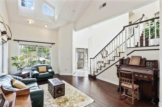 13440 Pala Ave, Sylmar, CA 91342 - living room with wood-type flooring, baseboards, high vaulted ceiling, and stairs