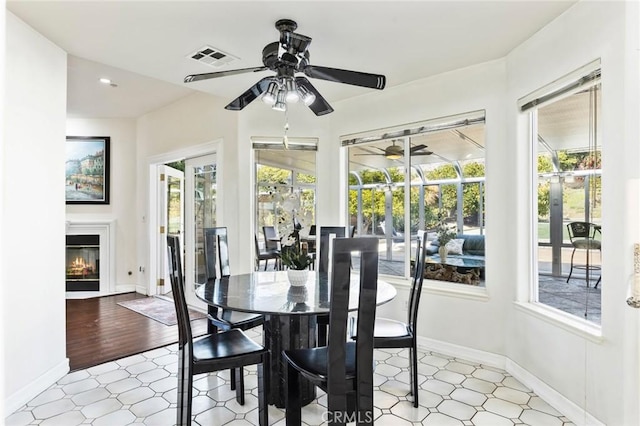 13440 Pala Ave, Sylmar, CA 91342 - dining area with healthy amount of natural light, ceiling fan, a sunroom, and a glass covered fireplace