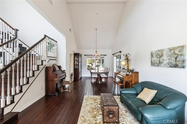 13440 Pala Ave, Sylmar, CA 91342 - living area with high vaulted ceiling, stairway, a chandelier, hardwood / wood-style floors, and baseboards