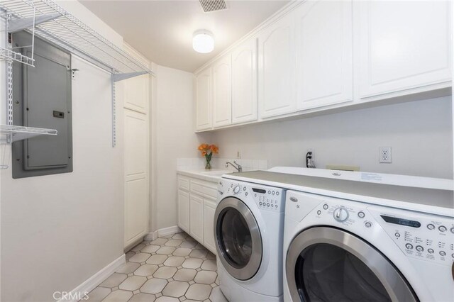 13440 Pala Ave, Sylmar, CA 91342 - laundry room featuring separate washer and dryer, cabinet space, and baseboards