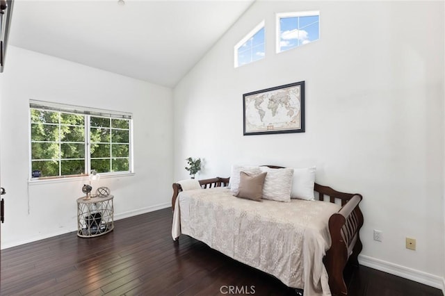 13440 Pala Ave, Sylmar, CA 91342 - bedroom with multiple windows, dark wood-type flooring, baseboards, and high vaulted ceiling