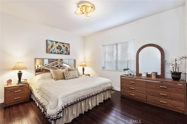 13440 Pala Ave, Sylmar, CA 91342 - bedroom with baseboards and dark wood-type flooring