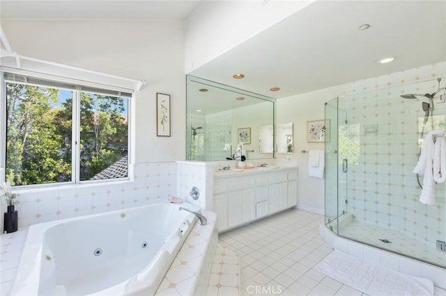 13440 Pala Ave, Sylmar, CA 91342 - bathroom featuring double vanity, a shower stall, a jetted tub, tile patterned floors, and recessed lighting