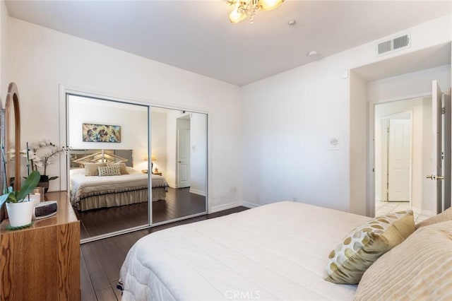 13440 Pala Ave, Sylmar, CA 91342 - bedroom featuring wood finished floors, a closet, and baseboards