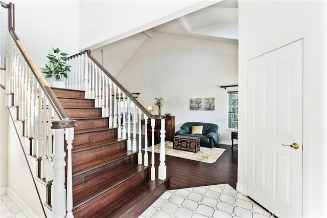 13440 Pala Ave, Sylmar, CA 91342 - stairway with beam ceiling, wood finished floors, high vaulted ceiling, and baseboards