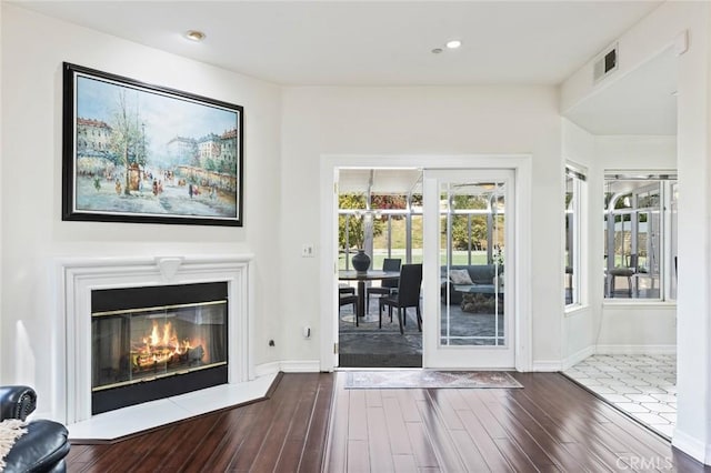 13440 Pala Ave, Sylmar, CA 91342 - living room with wood finished floors, baseboards, recessed lighting, and a glass covered fireplace