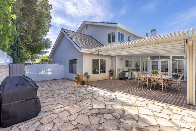 13440 Pala Ave, Sylmar, CA 91342 - back of house featuring a pergola, stucco siding, a patio area, and a chimney
