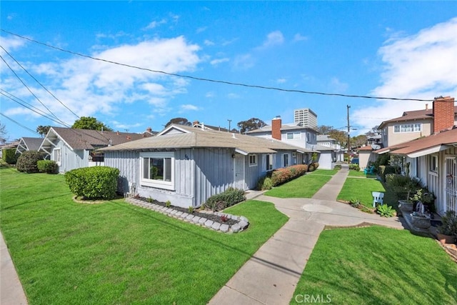 view of home's exterior with a residential view and a yard