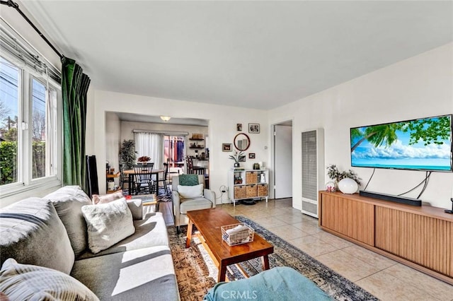 living area featuring light tile patterned flooring