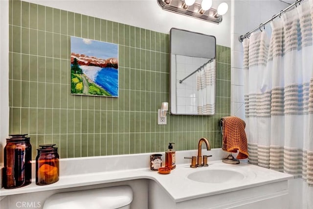 full bath featuring curtained shower, tile walls, and vanity