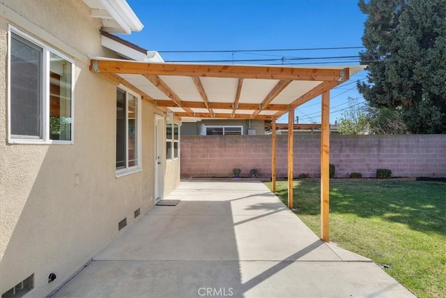 view of patio featuring fence