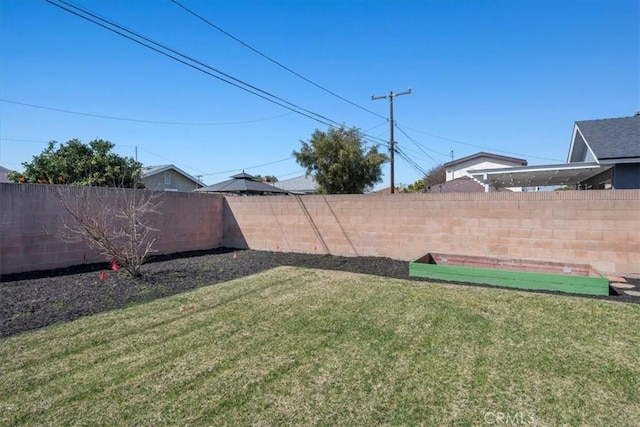 view of yard with a fenced backyard