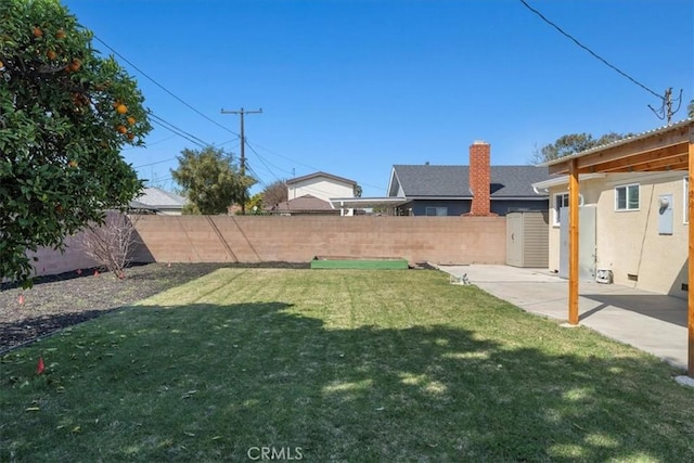 view of yard with a patio and a fenced backyard