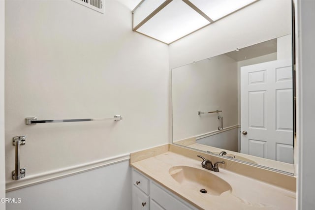 bathroom featuring visible vents and vanity