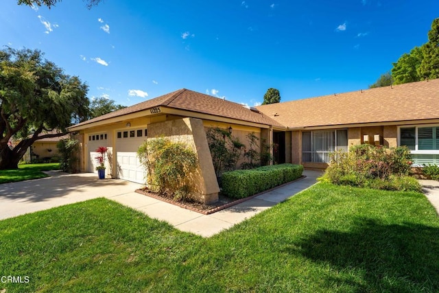 single story home with an attached garage, driveway, a front lawn, and stucco siding