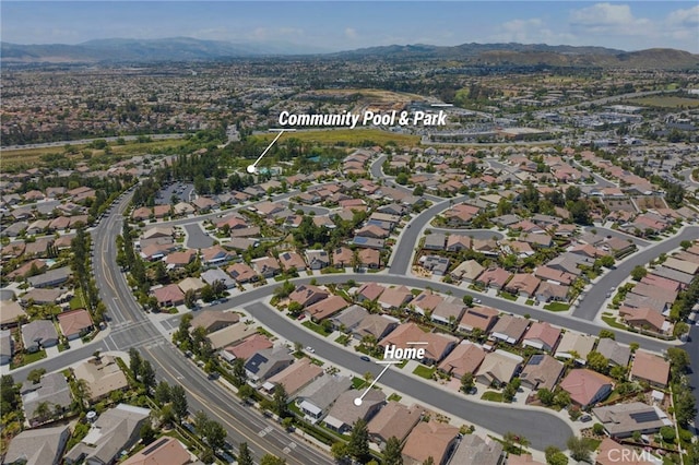 drone / aerial view featuring a residential view and a mountain view