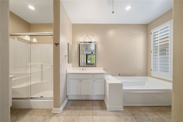 full bathroom featuring a garden tub, tile patterned flooring, vanity, and a shower stall