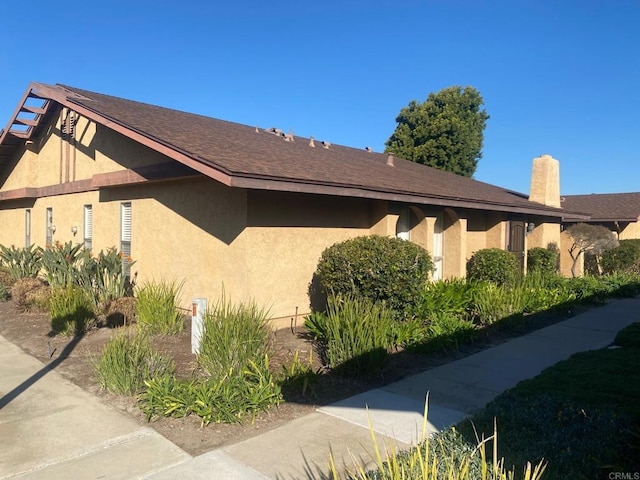 view of property exterior with stucco siding