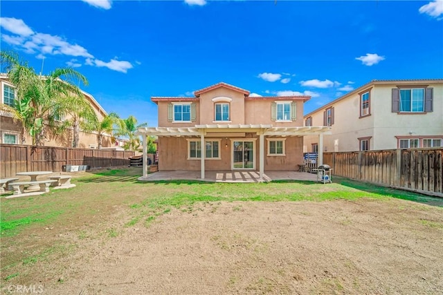 back of house with stucco siding, a fenced backyard, a pergola, and a patio