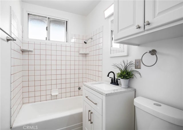 bathroom featuring toilet, shower / tub combination, and vanity