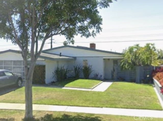 view of front of home with a front yard