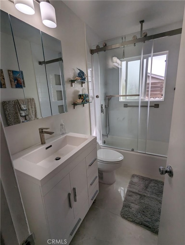 full bath featuring toilet, vanity, and a combined bath / shower with rainfall shower