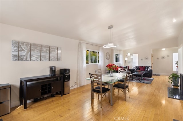 dining space with light wood finished floors