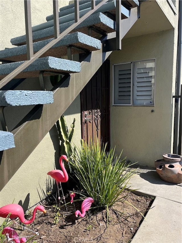 view of side of home featuring stucco siding