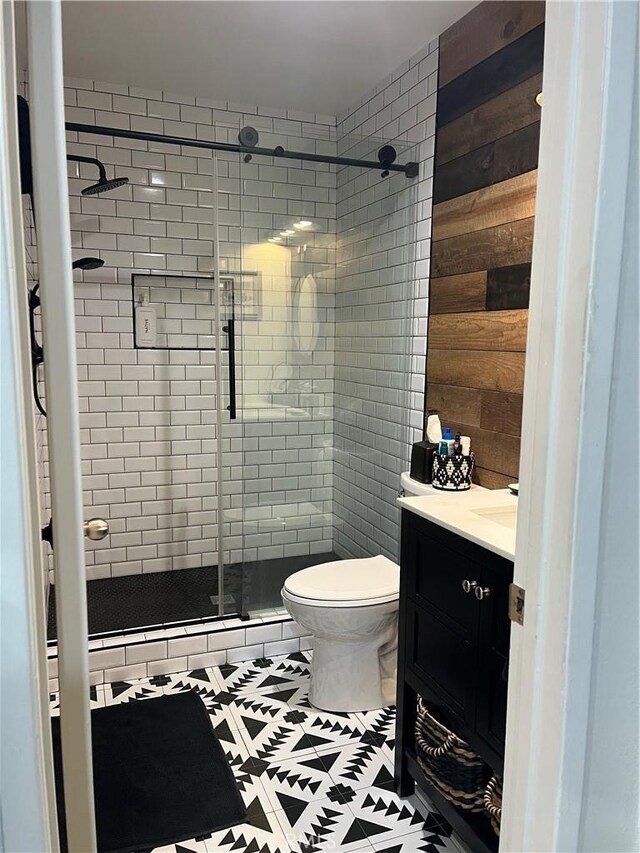 5001 Stoney Creek Rd Unit 356, Culver City, CA 90230 - bathroom with vanity, a shower stall, and wooden walls