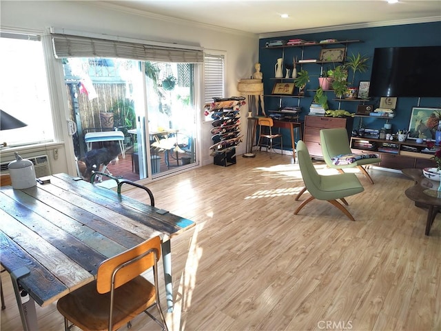 office space featuring crown molding, an AC wall unit, and wood finished floors