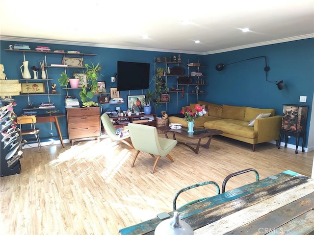 living area featuring wood finished floors and ornamental molding