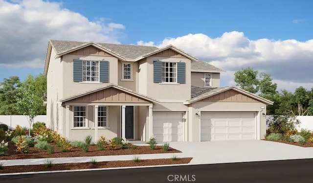 traditional-style home featuring driveway, fence, and stucco siding