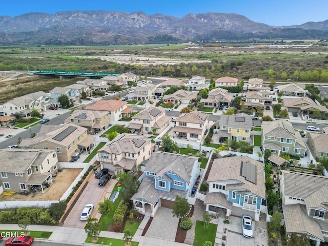 birds eye view of property with a residential view and a mountain view