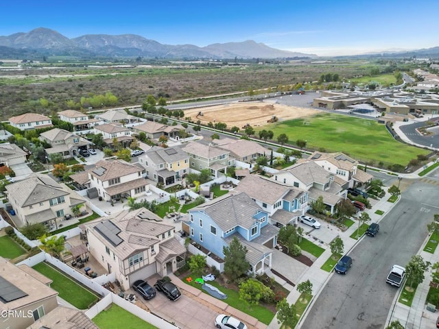 birds eye view of property with a residential view and a mountain view