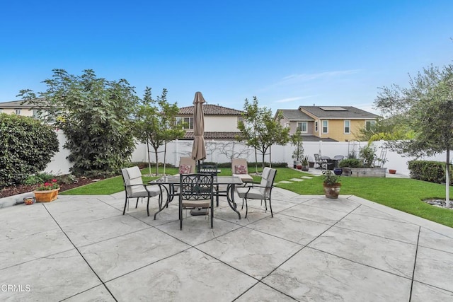 view of patio featuring outdoor dining space and a fenced backyard