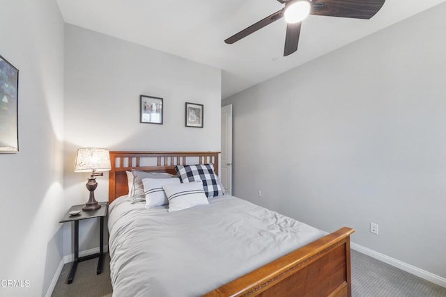 carpeted bedroom featuring ceiling fan and baseboards