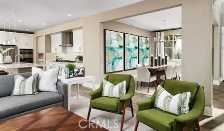 living room with recessed lighting and a notable chandelier