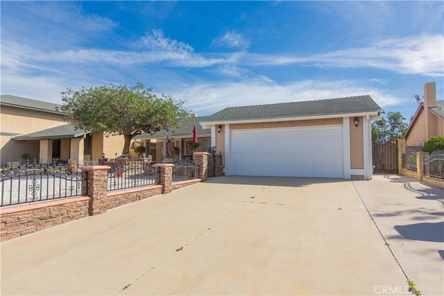 single story home with a garage, a fenced front yard, concrete driveway, and stucco siding