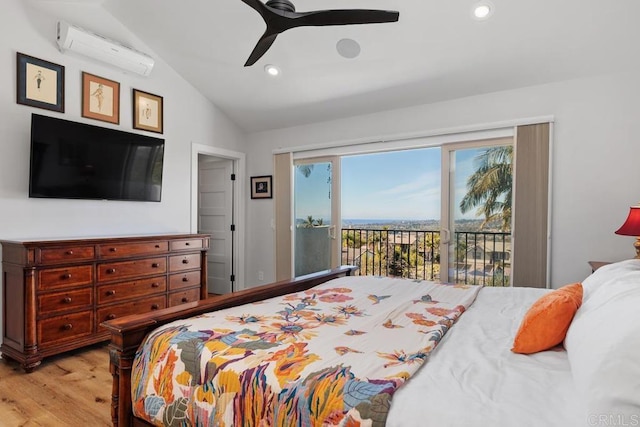 bedroom with light wood finished floors, a wall mounted air conditioner, access to outside, vaulted ceiling, and recessed lighting