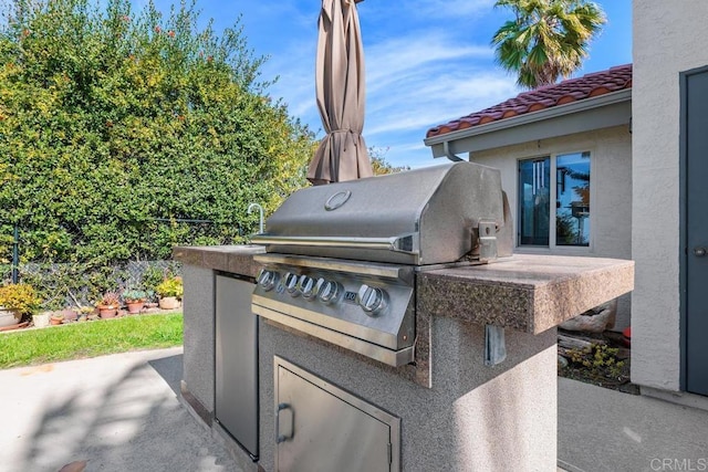 view of patio with a grill and exterior kitchen