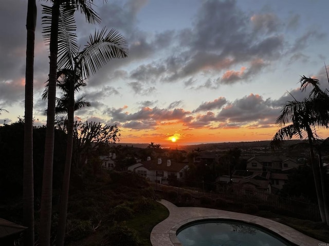 view of pool with a residential view