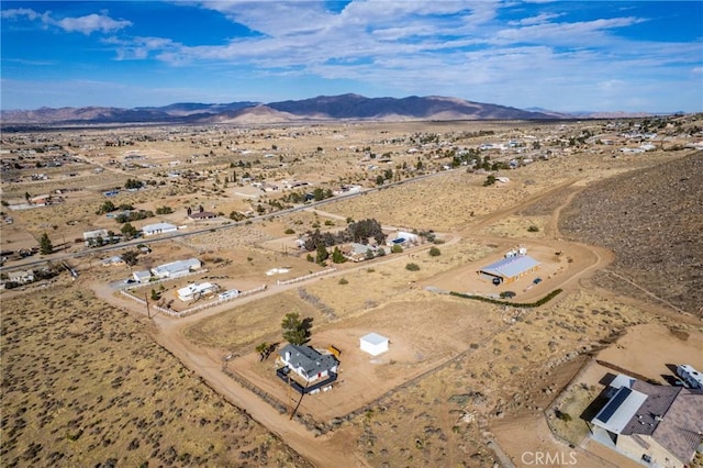 drone / aerial view with a rural view, a desert view, and a mountain view